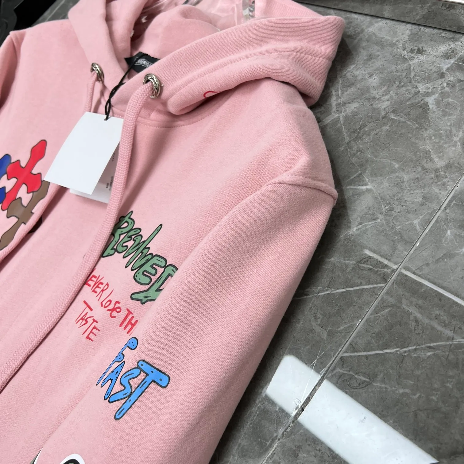 P250 Chrome Hearts Autumn and Winter 2025 counter synchronized Sanskrit hand-painted graffiti hooded sweatshirt, a must-have for Ins celebrity couples, same style for men and women! Specially customized version of 1:1 high-weight fabric, the same style as fashionable celebrities, a must-have for Internet celebrities! Recommended color: pink Size: S, M, L, XL